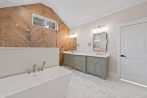 Spa-inspired owner's suite bathroom in 3650 Beroth Circle with freestanding soaking tub, oversized walk-in shower, double vanity, decorative tile work, and serene natural lighting