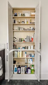 Custom wall-inset storage cabinet built into bathroom wall for hidden organization in Greensboro bathroom remodel by Lakenridge Builders.